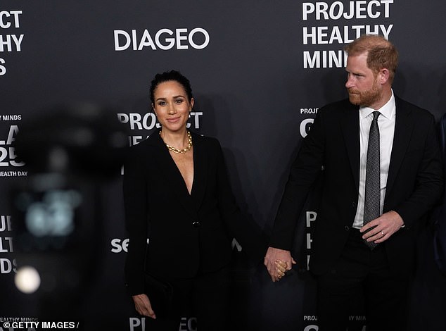 Harry and Meghan’s awkward red carpet moments: Prince hurries along his wife in front of photographers – and she waits on her own backstage as couple win ‘Humanitarians of the Year’