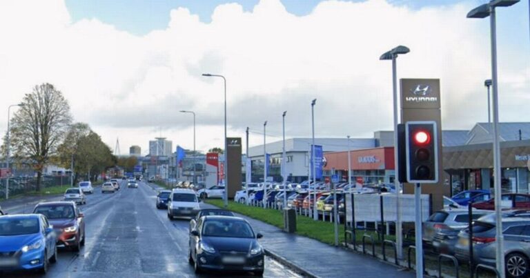 Man violently attacked outside car dealership