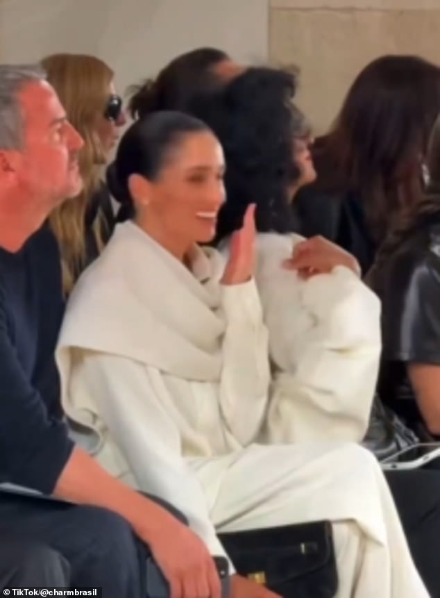 Meghan is accused of ‘giggling as model stumbles on the catwalk’: More Paris Fashion Week disasters emerge, including awkward moment with Kristin Scott Thomas