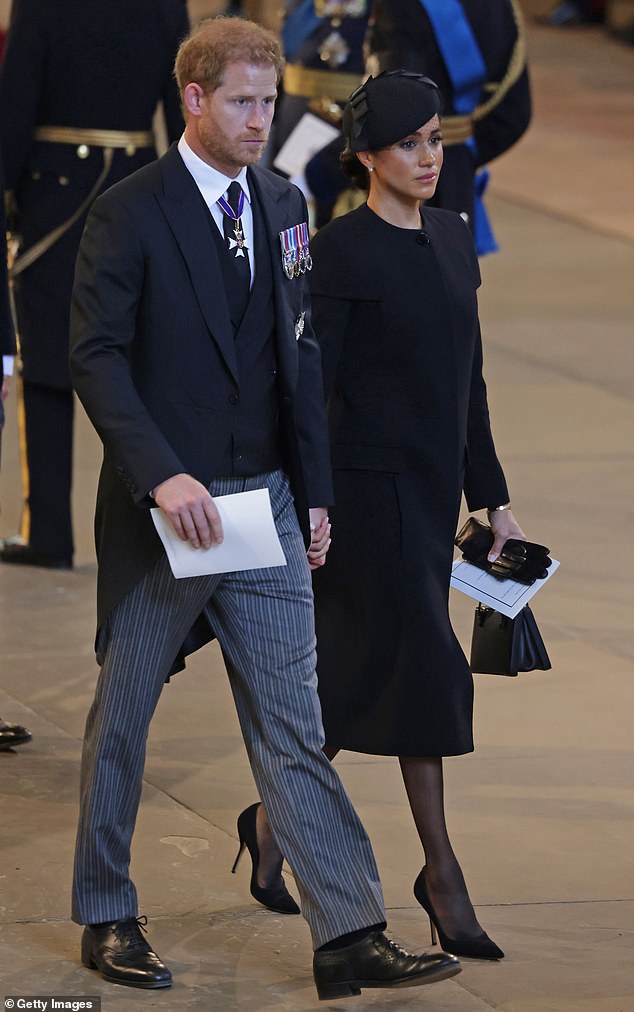 Prince Harry’s AWKWARD hand holding allowed him to ‘steer’ Meghan Markle at Westminster Hall, body language expert claims