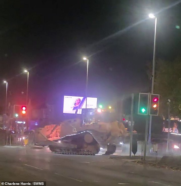 Moment ‘stolen’ 24-tonne bulldozer smashes through Royal Mail lorry as stunned onlookers watch on