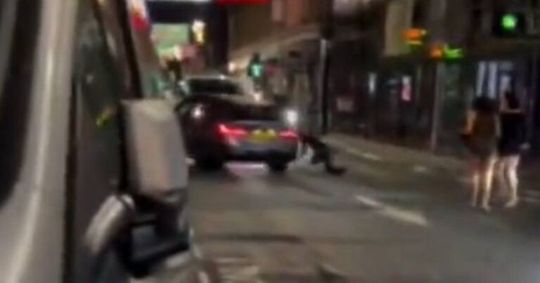 Moment BMW driver ‘drives at pedestrians’ as locals shout ‘he’s going to kill someone’